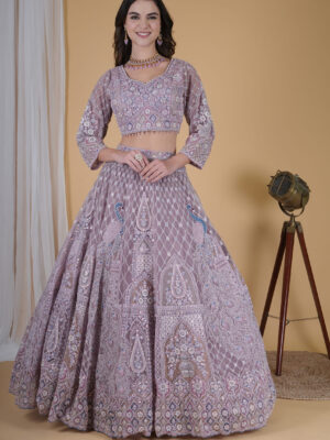 The Peacock Embroidered Lehenga (3/4th Sleeve) celebrates grandeur through vibrant artistry and exquisite detailing. Designed with precision, this lehenga showcases magnificent peacock embroidery that brings alive India’s royal heritage. The bold yet graceful design makes it ideal for festive and wedding celebrations. Crafted from premium silk blend fabric, it ensures both comfort and luxury. The lehenga’s intricate embroidery reflects the elegance of traditional craftsmanship, while the shimmering threads highlight each peacock motif beautifully. The rich hues create a striking visual, giving this outfit a timeless appeal that turns every head. The matching blouse with 3/4th sleeves enhances its regal charm. The sleeves add balance and sophistication, offering an elegant silhouette suitable for both traditional and modern occasions. The flowing skirt moves gracefully, making every step radiant and confident. Why Choose the Peacock Embroidered Lehenga (3/4th Sleeve): Detailed Peacock Embroidery: Symbolizes beauty, pride, and grace. 3/4th Sleeve Blouse: Offers modesty with a refined, elegant finish. Premium Fabric: Feels soft, breathable, and luxurious on the skin. Perfect Festive Hue: Rich tones that complement every skin shade. Versatile Styling: Suitable for weddings, receptions, and festive events. Flawless Fit: Tailored for a flattering drape and easy movement. Pair it with gold jewelry and soft waves for a look that radiates royal charm. The lehenga transitions seamlessly from day ceremonies to evening festivities, glowing under every light. The craftsmanship of this outfit reflects dedication and artistry, ensuring you feel both confident and comfortable throughout your event. Every detail—from the fine embroidery to the perfect color balance—enhances its visual appeal. Wear the Peacock Embroidered Lehenga (3/4th Sleeve) to make an unforgettable statement. It’s not just festive attire—it’s a masterpiece that blends cultural artistry with contemporary elegance, crafted for the woman who loves standing out with grace.